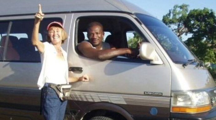 Margot beside her tour van on the original website