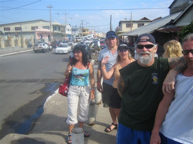 Travel group standing together on a Jamaican street