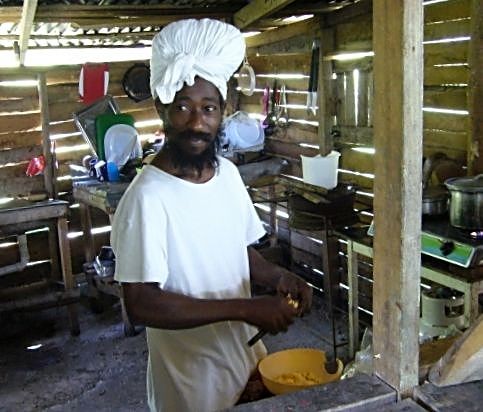 Cook preparing food in a Jamaican kitchen