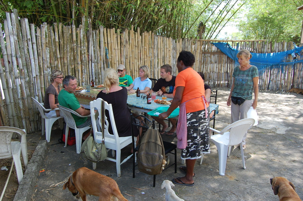 Guests sharing lunch outdoors at a stop shown on Margot’s original site