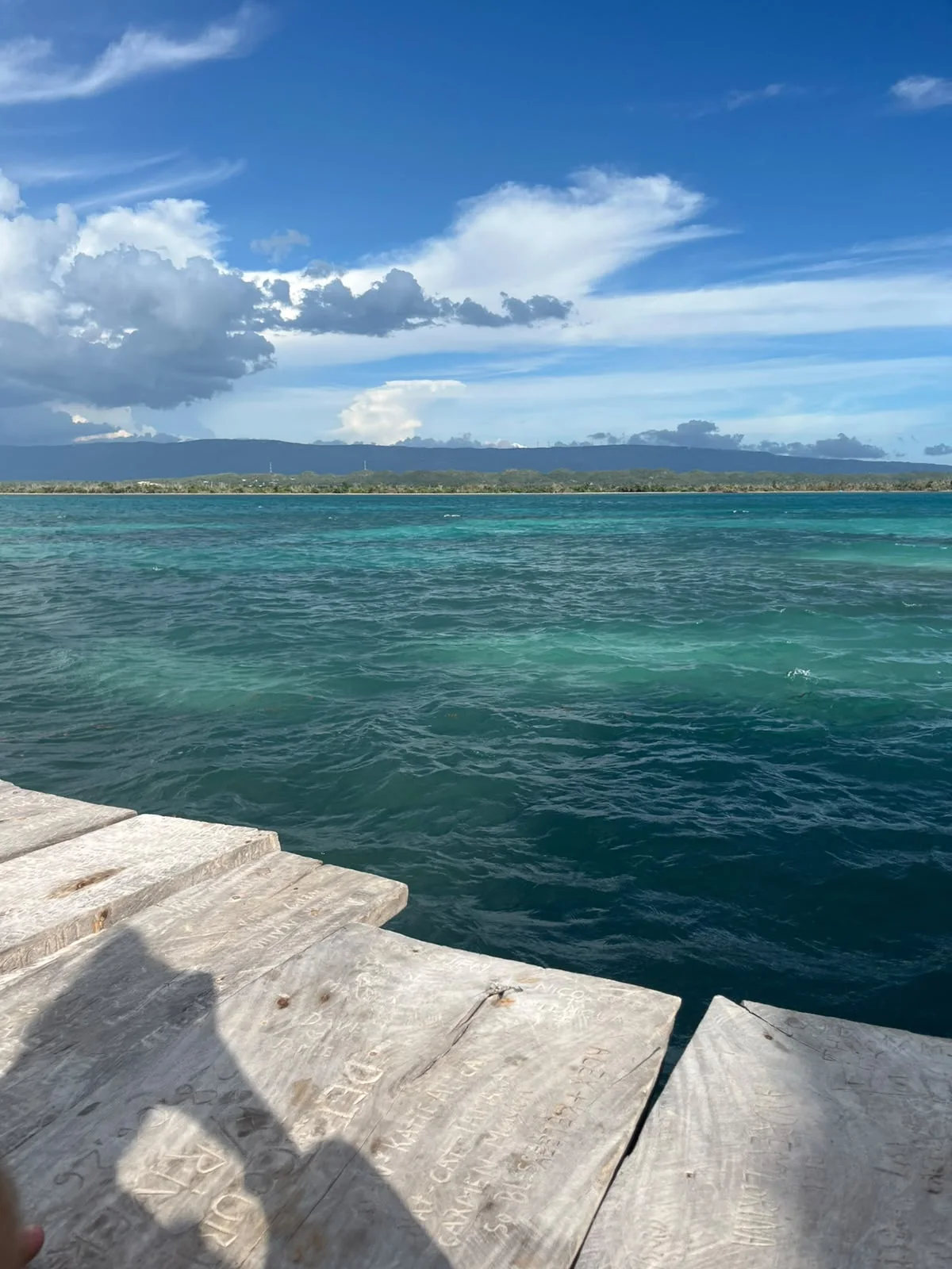 Turquoise sea seen from the wooden deck of Pelican Bar